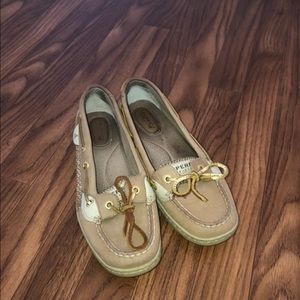 Gold soarkled sperry’s.